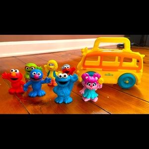 Sesame Street figures and bus